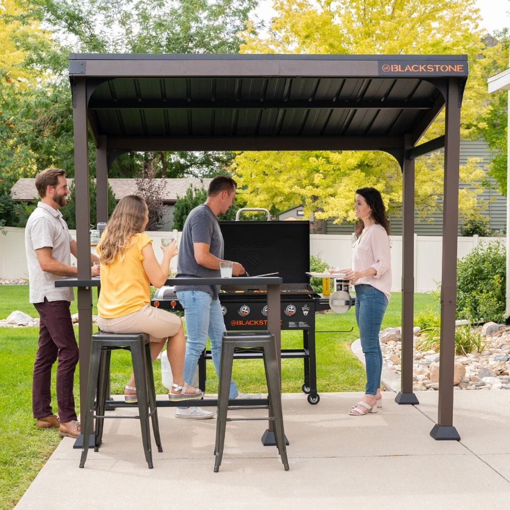 Provide your cooking space with a sturdy roof. Built with galvanized steel construction, a bar, and space for up to two griddles or prep carts, this pavilion will be your backyard event center.