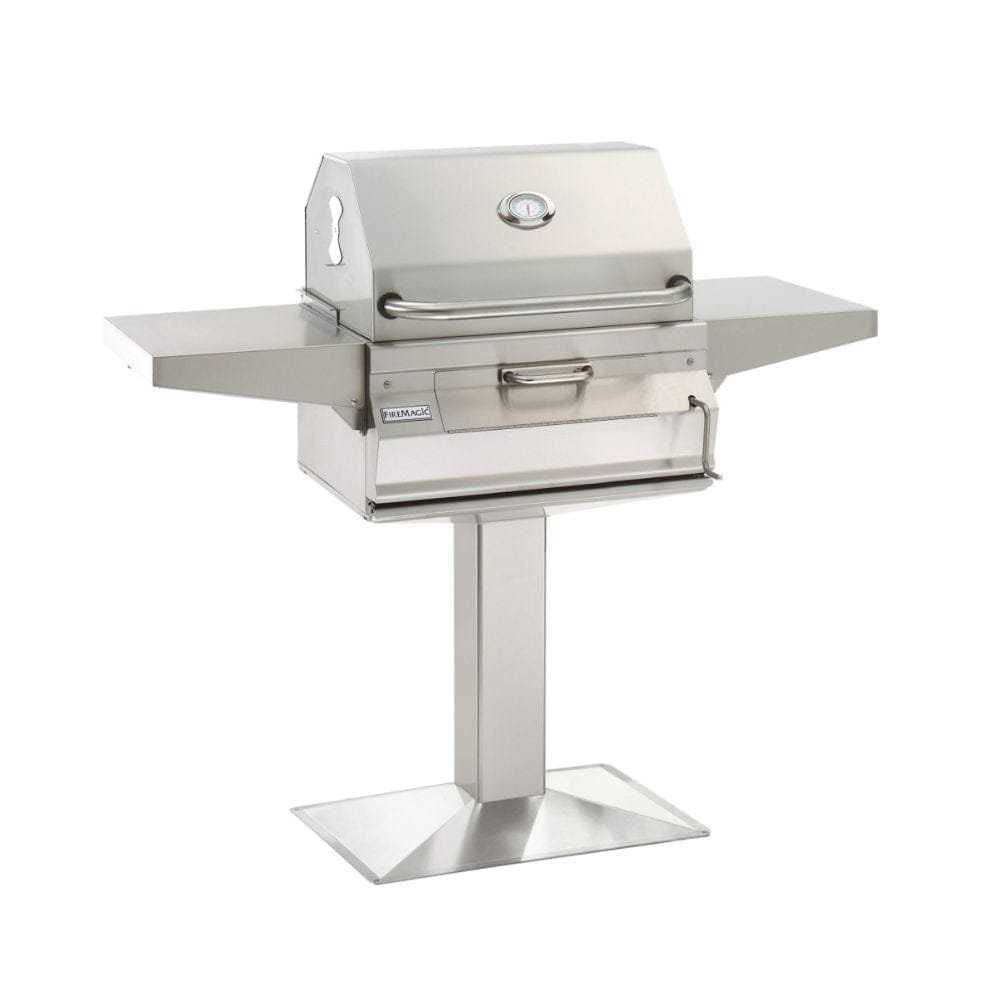 The Fire Magic 24" Post Mount Stainless Steel Charcoal Grill features a 432 sq. in. cooking surface, all stainless steel construction, and a heavy-duty stainless smoker hood with a precise analog thermometer