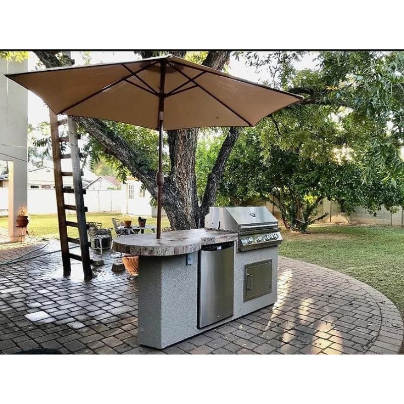 Elevate your outdoor cooking and entertaining with the KoKoMo Grills 7'6" Maui Outdoor Kitchen Island featuring a 33" round top bar.